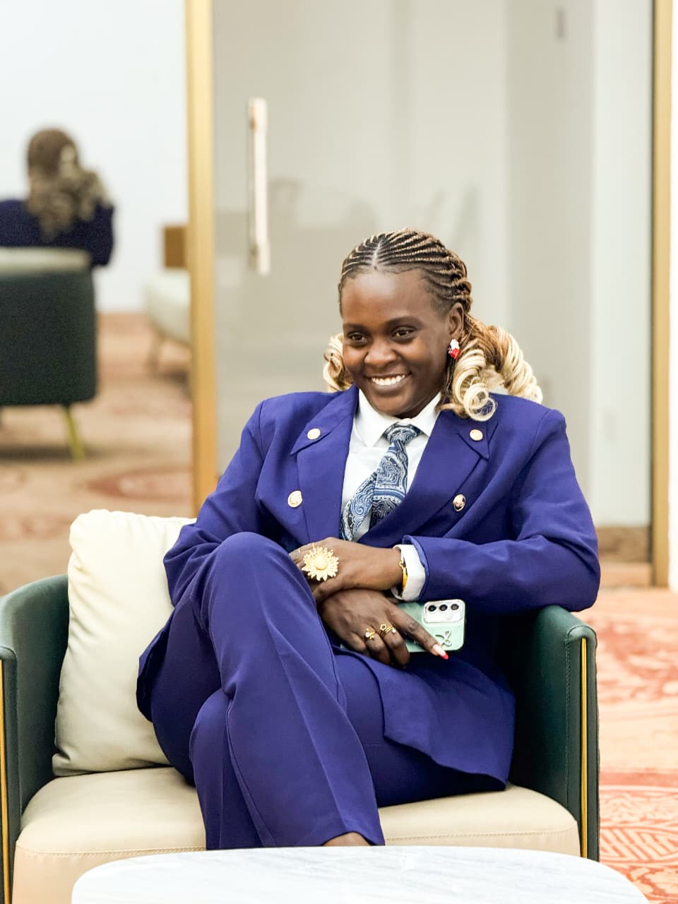 Jeannete Hope Wangara seated in a blue tailored suit